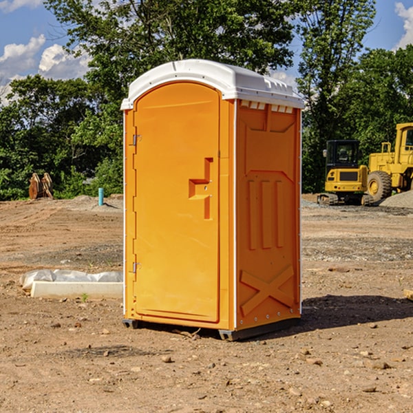 what is the cost difference between standard and deluxe portable toilet rentals in Russellville Missouri